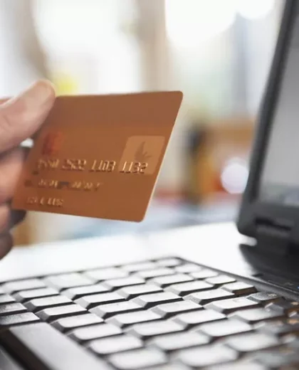 031877919-hand-holding-credit-card-front